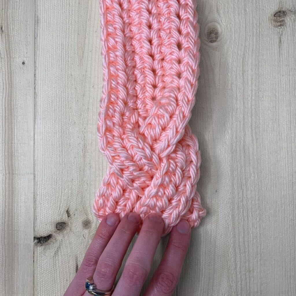 Cross the right crocheted section to the middle.